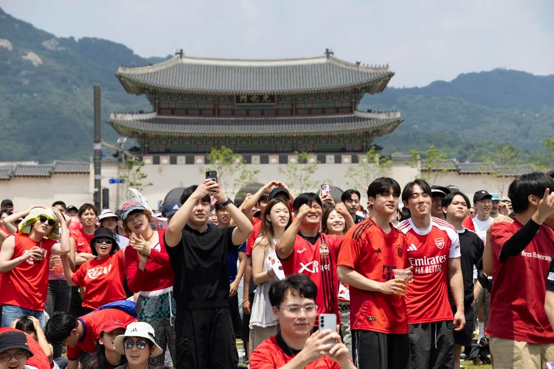 Football fans at Gwanghwamun Square in Seoul, South Korea, June 12, watching the group A preliminary round match between South Korea and Czech Republic at the FIFA World Cup in Mexico.