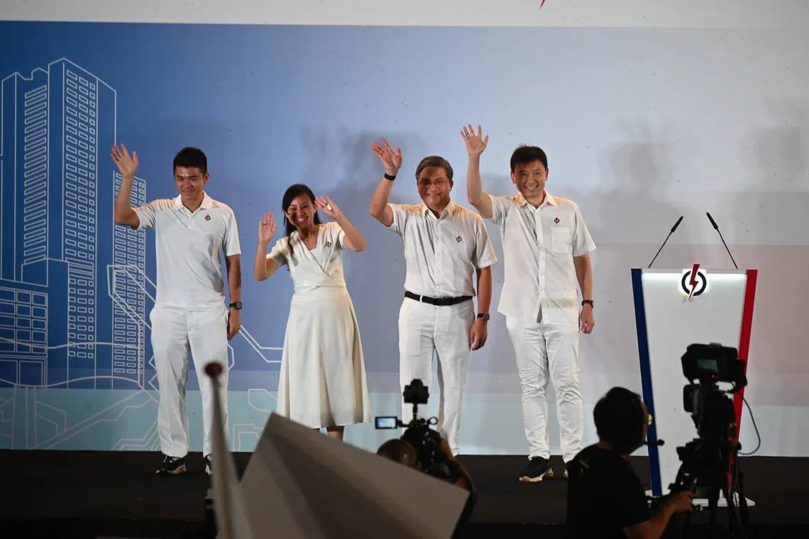 The PAP's Bishan-Toa Payoh GRC candidates (from left) Cai Yinzhou, Elysa Chen, Saktiandi Supaat and Chee Hong Tat greeting supporters at Yio Chu Kang Stadium on May 3.