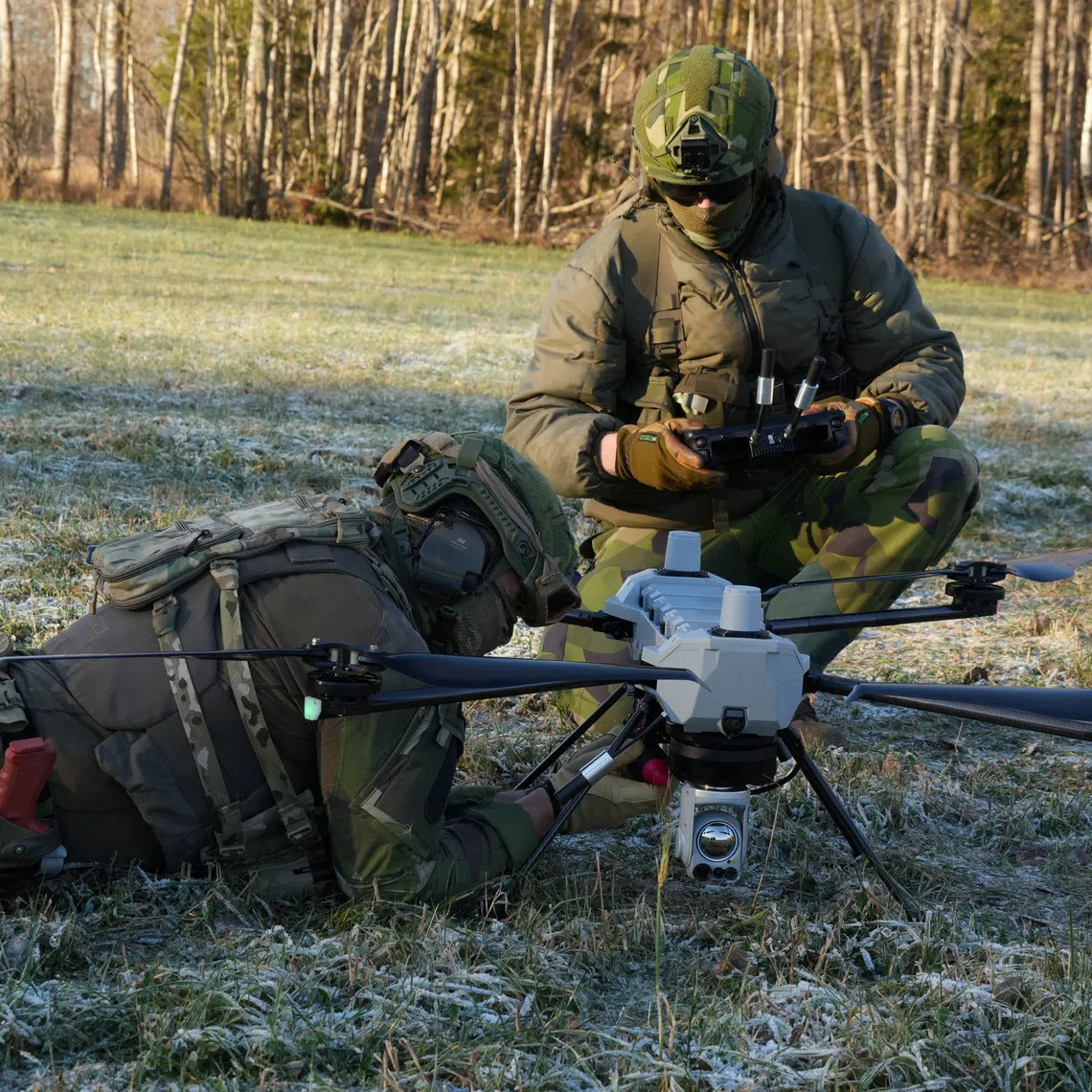 Soldiers from Sweden's 31st Ranger Battalion prepare to launch an unmanned aerial vehicle in a training demonstration in Sweden on Nov 21.