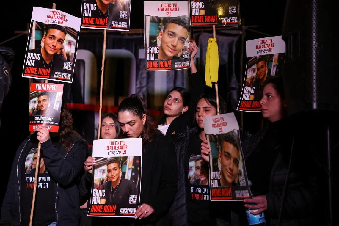 People carrying posters featuring Israeli-American hostage Edan Alexander demand the release of all hostages held in Gaza, in Jerusalem, on April 13.