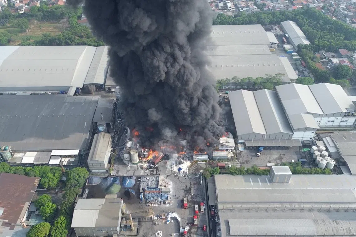 A drone view shows smoke and flames rising at a cooking oil factory, in Bekasi, West Java province, Indonesia November 1, 2024, in this screen grab obtained from a social media video. ILHAM APRIYANTO/via REUTERS