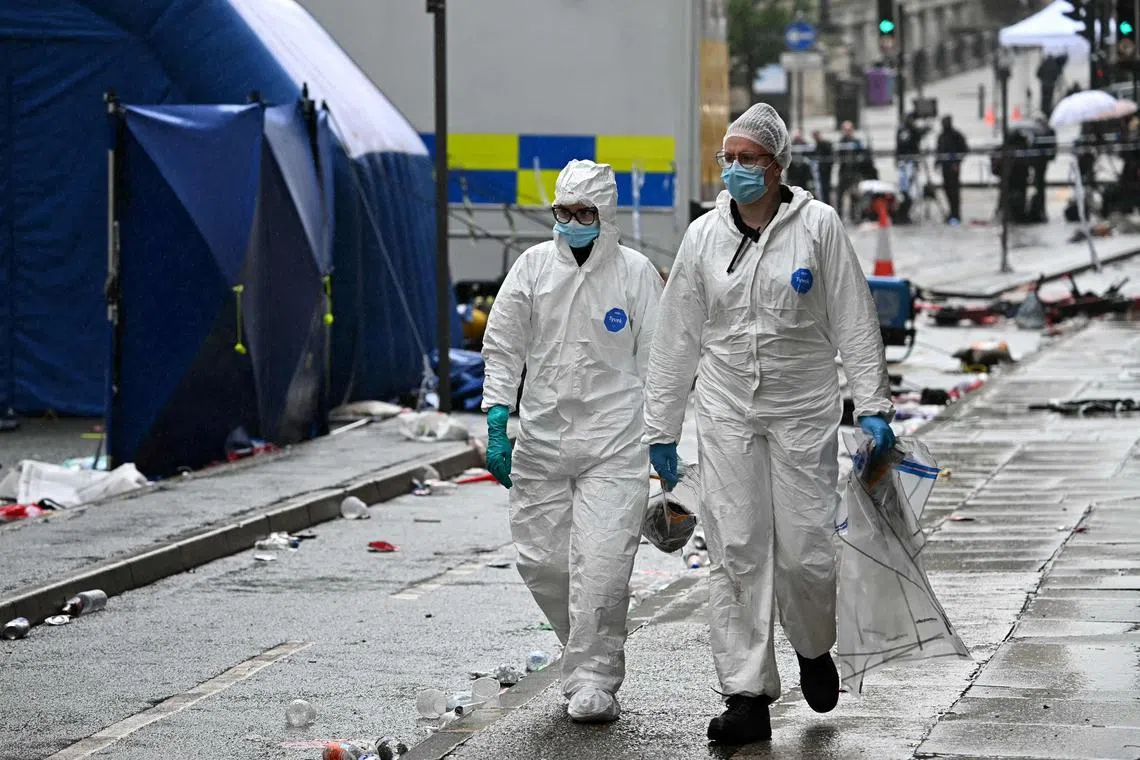 Police forensics officers working at the scene of the incident, in Liverpool, north-west England, on May 27.