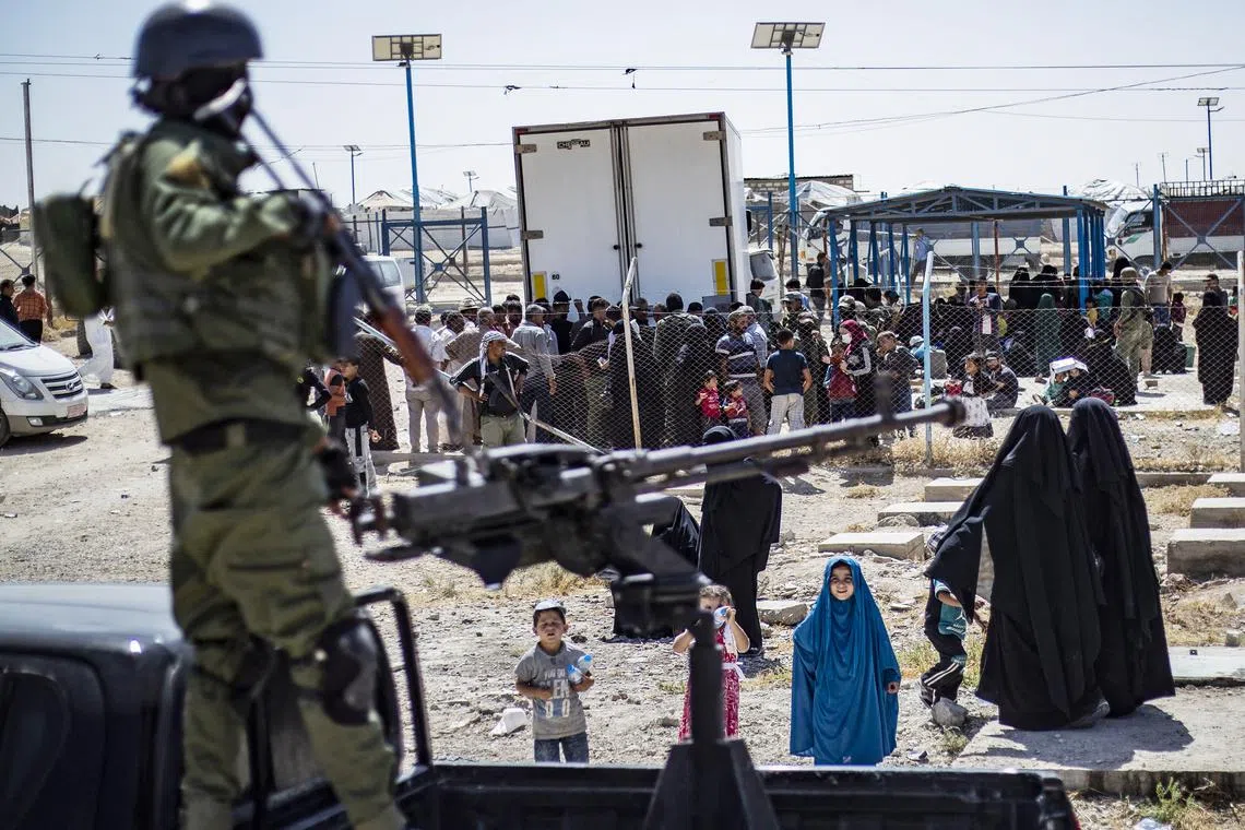 Released detainees prepare to leave the Kurdish-run al-Hol camp, which holds relatives of IS group fighters in Syria, on Sep 3, 2023.