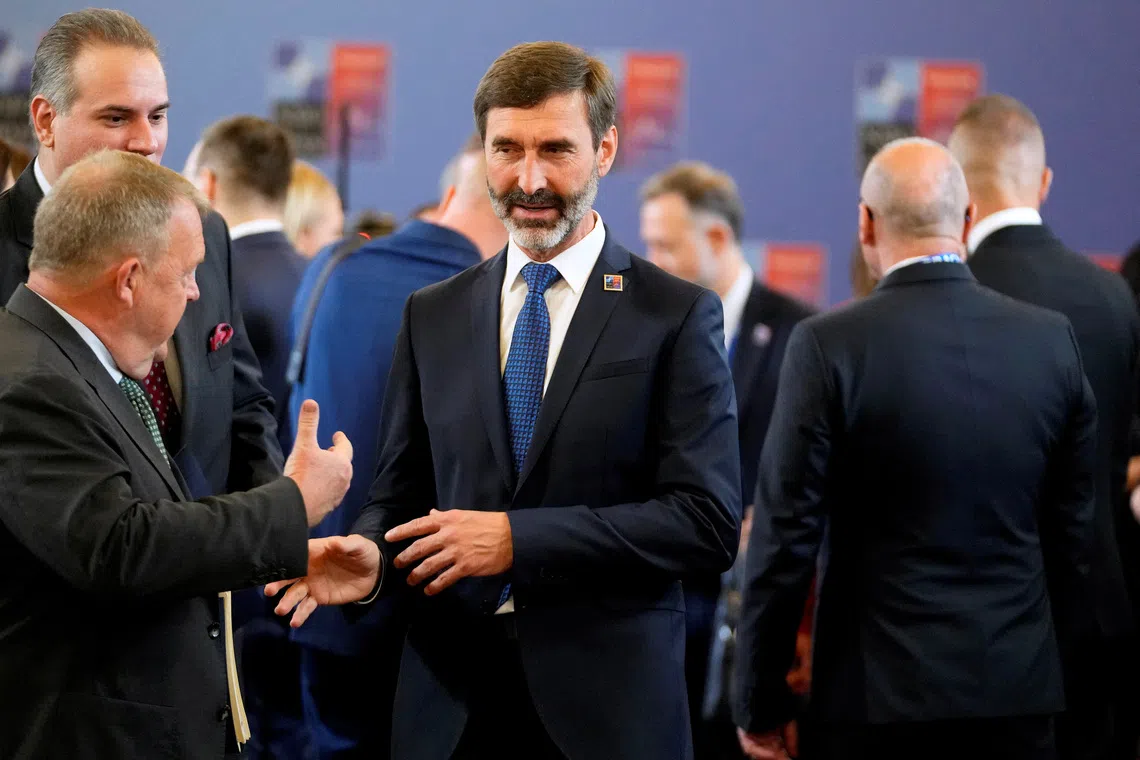 FILE PHOTO: Denmark’s Foreign Minister Lars Lokke Rasmussen speaks with Slovakia’s Foreign Minister Juraj Blanar during a meeting of NATO foreign ministers at the Czernin Palace, in Prague, Czech Republic, May 31, 2024. Peter David Josek/Pool via REUTERS/File Photo