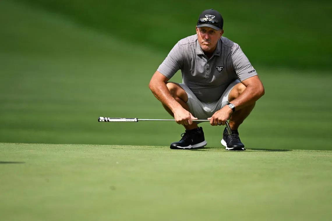 Phil Mickelson of the United States line up a putt on the 11th green during day one of the LIV Golf Invitational - Greenbrier at The Old White Course on Aug 4.