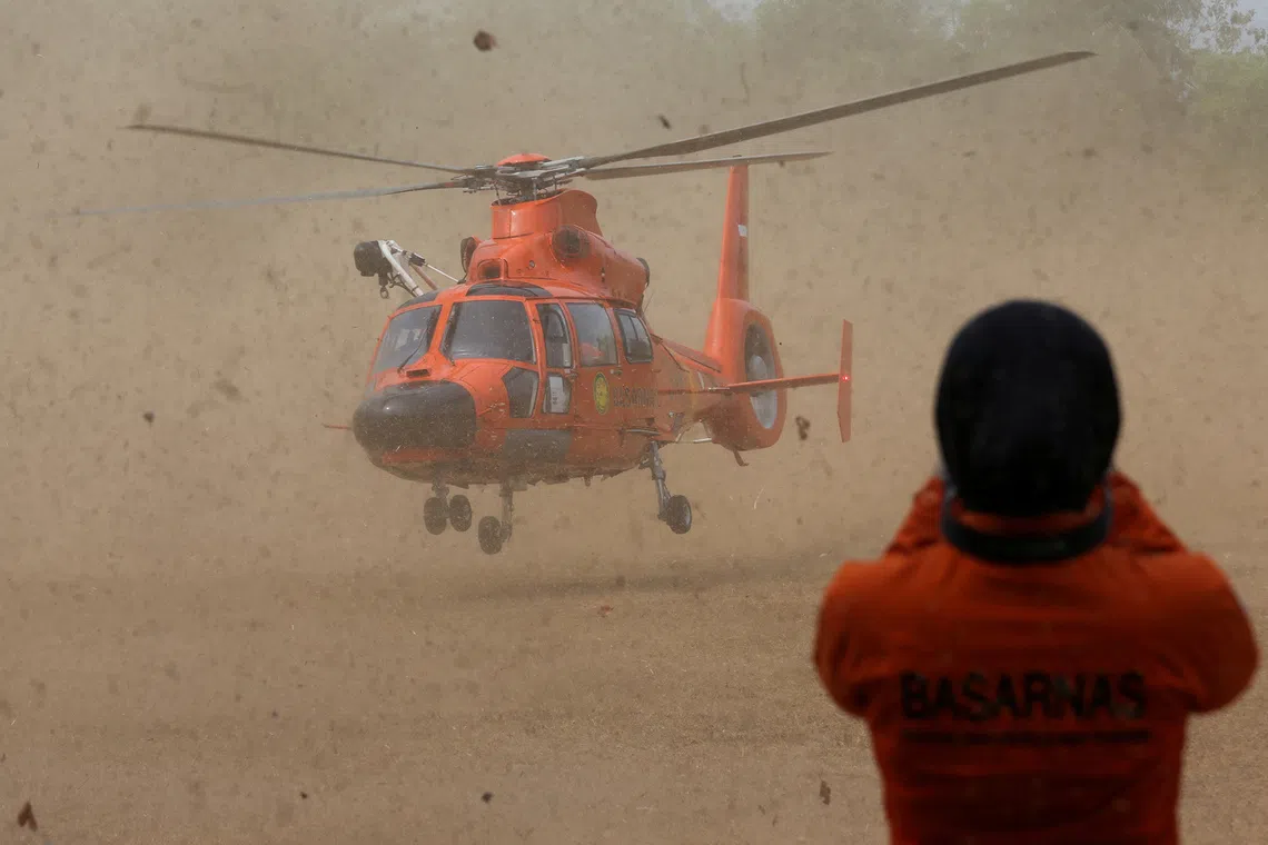 Indonesia's National Search and Rescue Agency (BASARNAS) helicopter lands on a field during a search operation for people who were reported missing in the waters of the Sunda Strait, including journalists covering the activity of Mount Anak Krakatau in Pandeglang, Banten province, Indonesia, September 10, 2026. REUTERS/Sammy