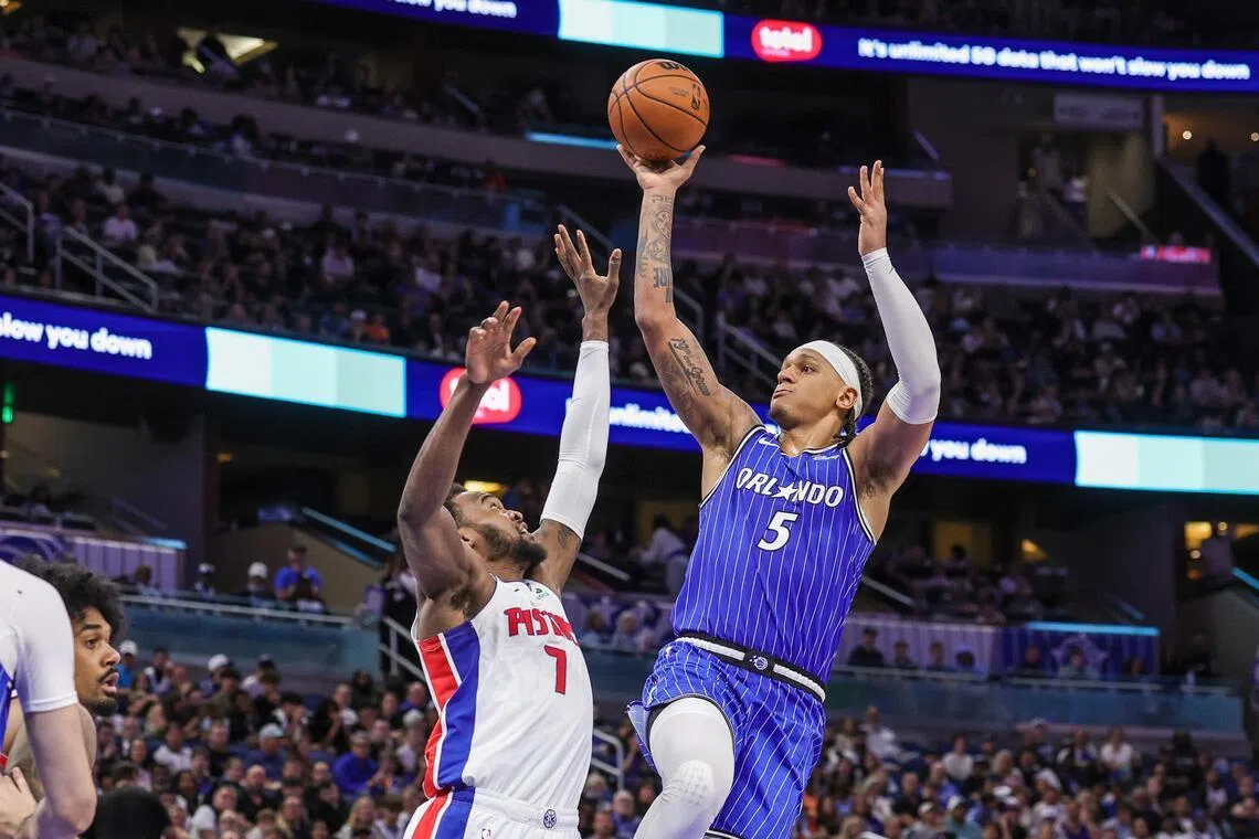 Paolo Banchero shooting against Detroit Pistons forward Paul Reed during the Orlando Magic's 123-107 NBA win at Kia Center on April 6, 2026.