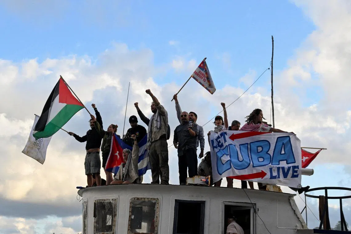 Activists and members of a flotilla coming from Mexico and carrying aid react upon their arrival to Havana’s bay amid a U.S. oil blockade that has dealt a major blow to the island's already ailing energy infrastructure, in Havana, Cuba, March 24, 2026. REUTERS/Norlys Perez