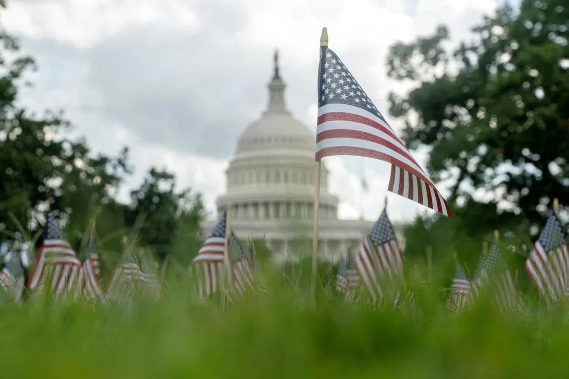 A single flag is planted in memory of Mr Charlie Kirk outside of the US Capitol on Sept 11 following his death. 