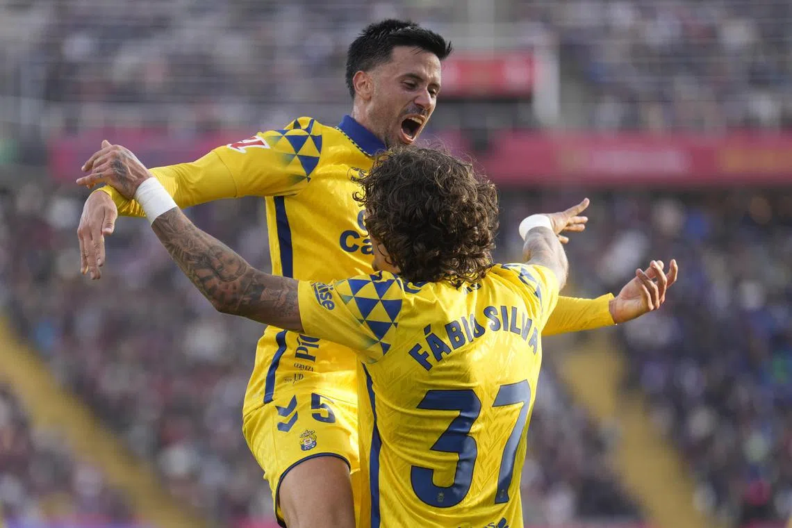 Las Palmas Fabio Silva (right) celebrates after scoring the winning goal against Barcelona.