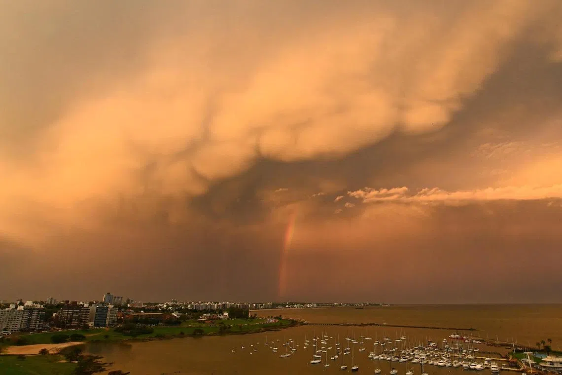 A rainbow and a mammatus cloud formation lit by the setting sun are seen in Montevideo, Uruguay, on April 21.