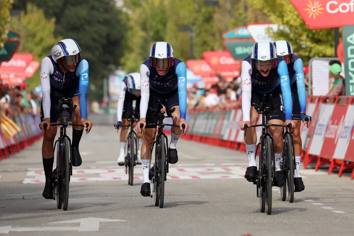 Cycling - Vuelta a Espana - Stage 5 - Figueres to Figueres - Figueres, Spain - August 27, 2025 Team Israel - Premier Tech cross the finish line after stage 5 REUTERS/Bruna Casas