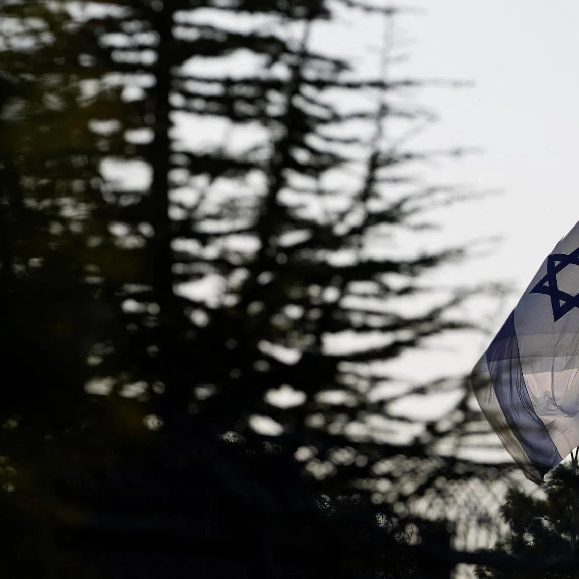 An Israeli flag flies outside the Prime Minister's Office  in Jerusalem, October 22, 2024. REUTERS/Nathan Howard/Pool