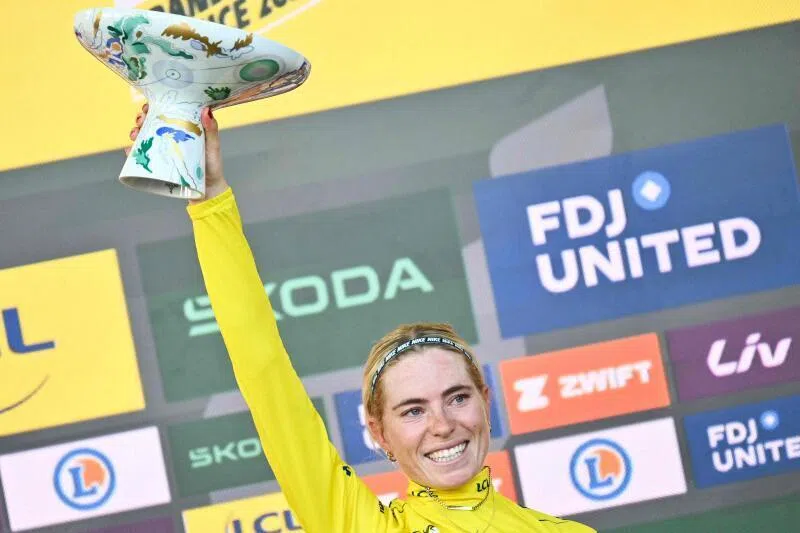 Dutch rider Demi Vollering celebrates on the podium with the overall leader’s yellow jersey after winning the 9th and final stage of the 2026 Tour de France Femmes, in Nice, France, on Aug 9.