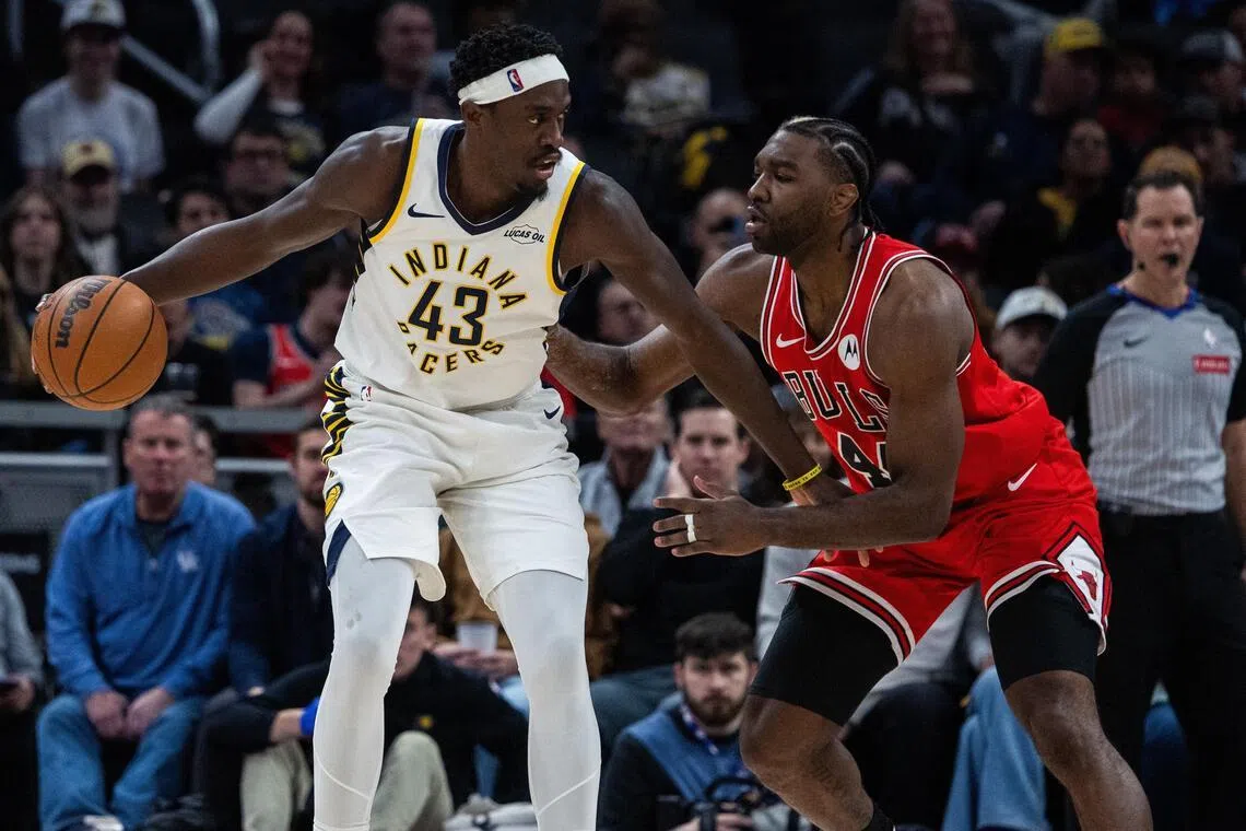 Indiana Pacers forward Pascal Siakam dribbling against Chicago Bulls forward Patrick Williams during the first half at Gainbridge Fieldhouse on Jan 28.