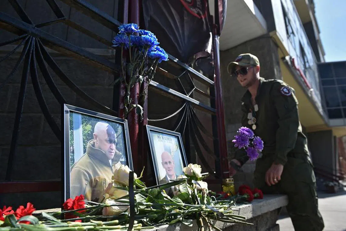 A view shows portraits of Russian mercenary chief Yevgeny Prigozhin and Wagner group commander Dmitry Utkin at a makeshift memorial outside the local office of the Wagner private mercenary group in Novosibirsk, Russia August 24, 2023. REUTERS/Stringer