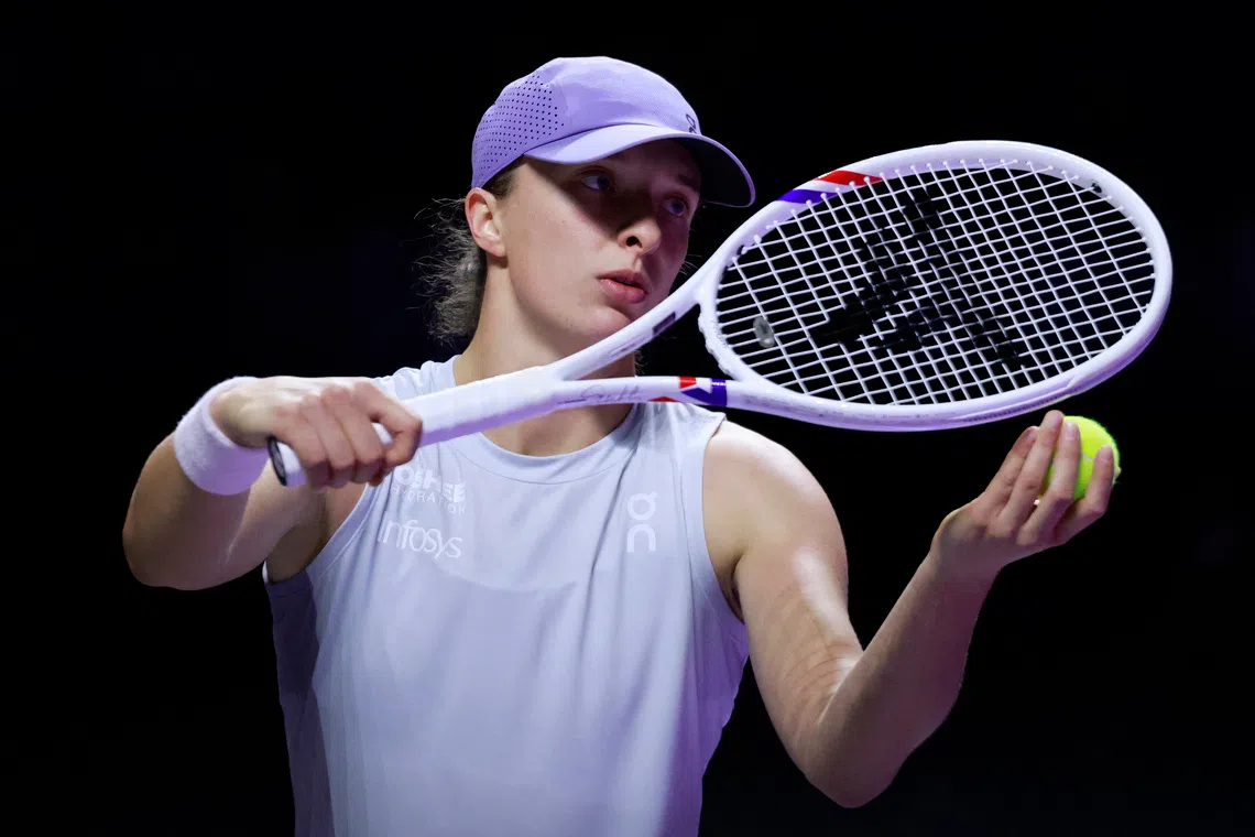 Tennis - WTA Finals - Riyadh - King Saud University Indoor Arena, Riyadh, Saudi Arabia - November 5, 2025 Poland's Iga Swiatek in action during her group stage match against Amanda Anisimova of the U.S. REUTERS/Stephanie Lecocq