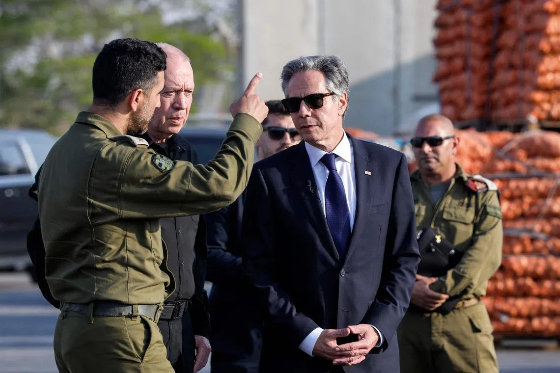 US Secretary of State Antony Blinken (centre) and Israeli Defence Minister Yoav Gallant (centre-left, behind), at the Kerem Shalom border crossing.