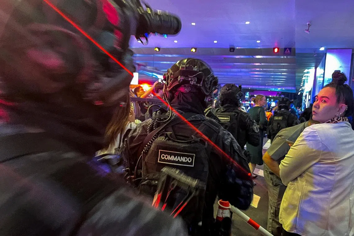 Thai police commando arriving following shots fired at the luxury Siam Paragon shopping mall, in Bangkok, Thailand on October 3, 2023. 