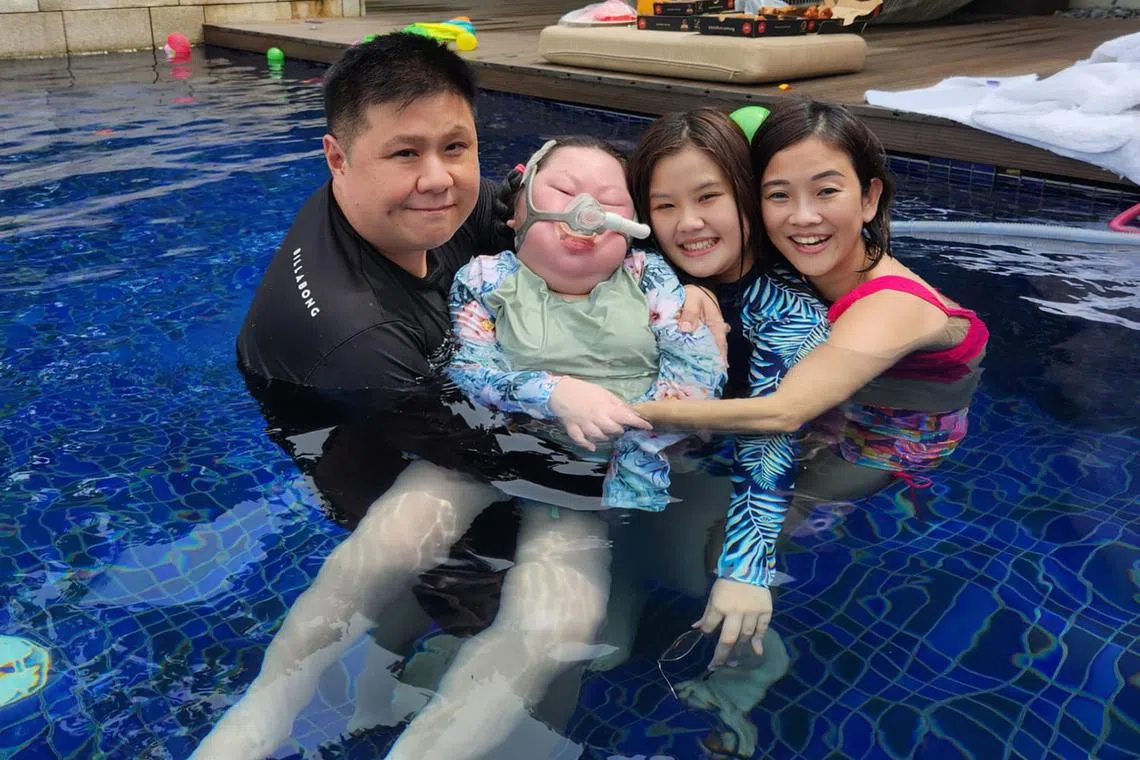 Amanda Ng (second from right) with her sister Amelia, who has a rare disorder, and their parents Ng Kin Nam and Wendy Loh.