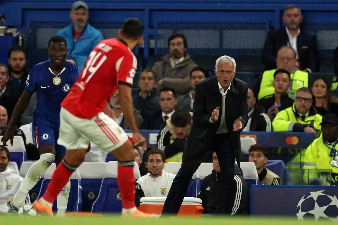 Benfica coach Jose Mourinho shouts instructions to his players from the touchline during the Champions League clash against his former side Chelsea.