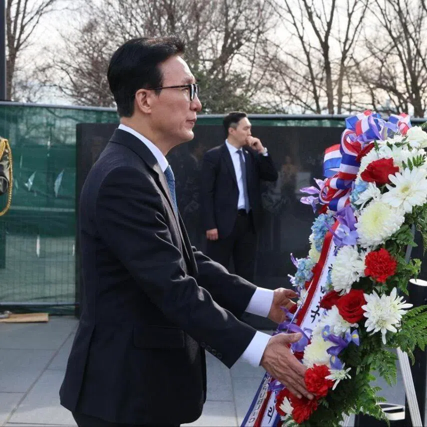 South Korean Prime Minister Kim Min-seok places a wreath during a visit to the Korean War Veterans Memorial in Washington, DC.