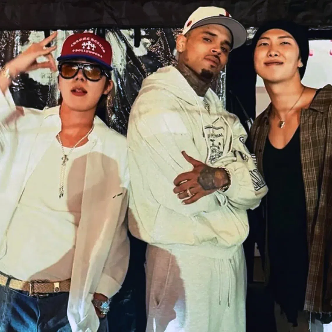 Chris Brown posted a picture with BTS leader Kim Namjoon and rapper Jung Hoseok on Aug 13.