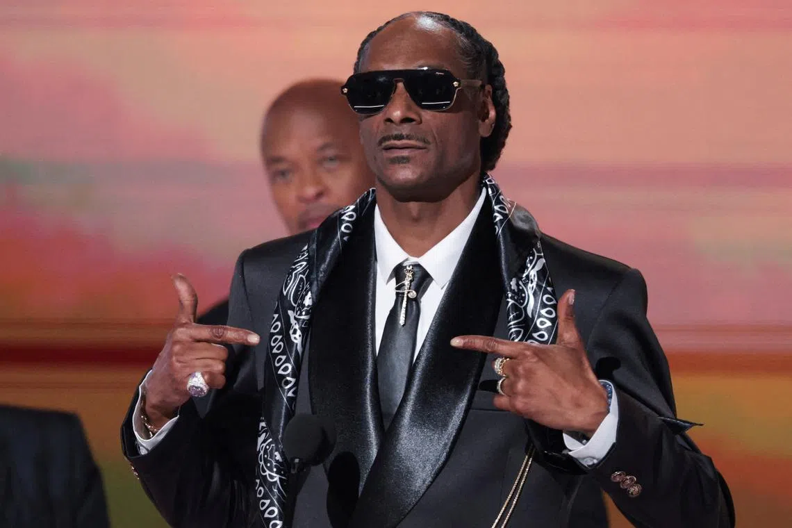 FILE PHOTO: Snoop Dogg gestures on stage at the 25th annual BET (Black Entertainment Television) Awards, in Los Angeles, California, U.S. June 9, 2025. REUTERS/Mario Anzuoni/File Photo