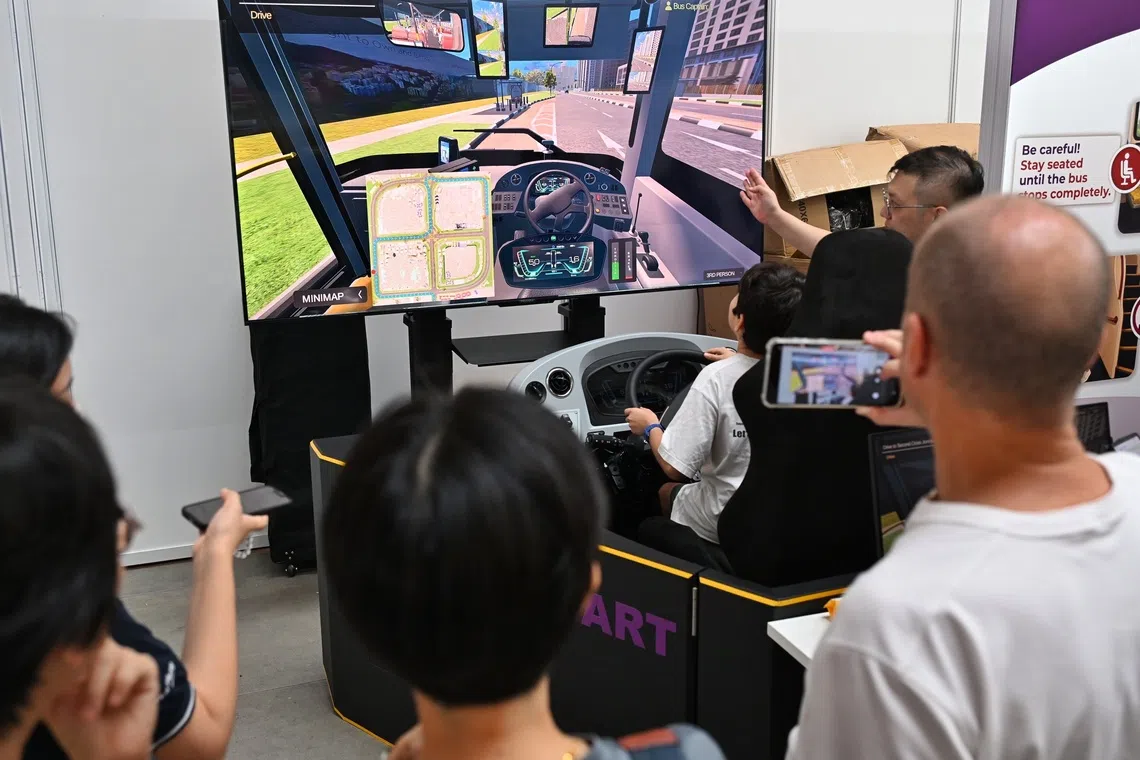 Visitors at the SBST driving simulator booth at the LTA Annual Public Safety & Security Awards and Bus Safety Roadshow on Aug 21.
