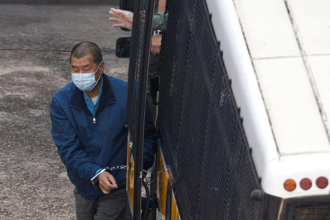 FILE PHOTO: Media mogul Jimmy Lai Chee-ying, founder of Apple Daily, arrives at Lai Chi Kok Reception Centre by prison van after remained in custody over fraud charge, in Hong Kong, China December 3, 2020. REUTERS/Tyrone Siu/File Photo