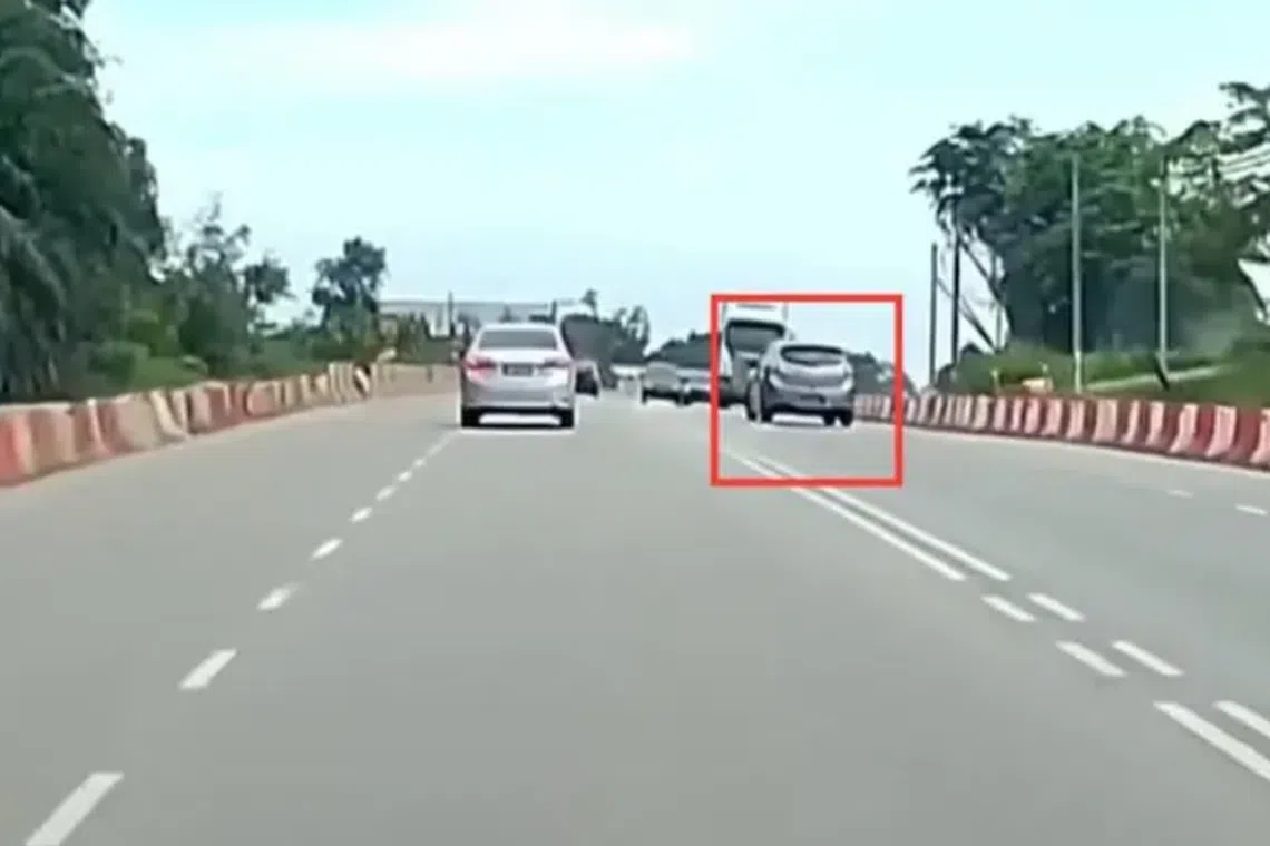 The vehicle could be seen driving along the opposite lane before swerving back into the correct lane as it nears an oncoming lorry and other cars.