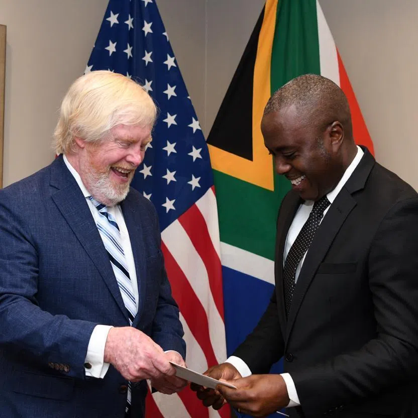 US Ambassador to South Africa Leo Brent Bozell III (left) presenting his credentials on Feb 23 to a representative from South Africa's Department of International Relations and Cooperation.