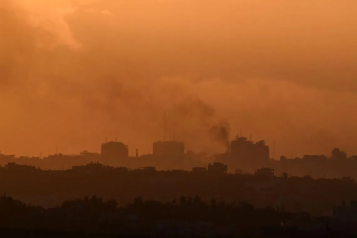 Smoke rises from Gaza, as the sun sets, amid the ongoing conflict between Israel and the Palestinian Islamist group Hamas, as seen from Sderot, Israel, February 9, 2024. REUTERS/Dylan Martinez