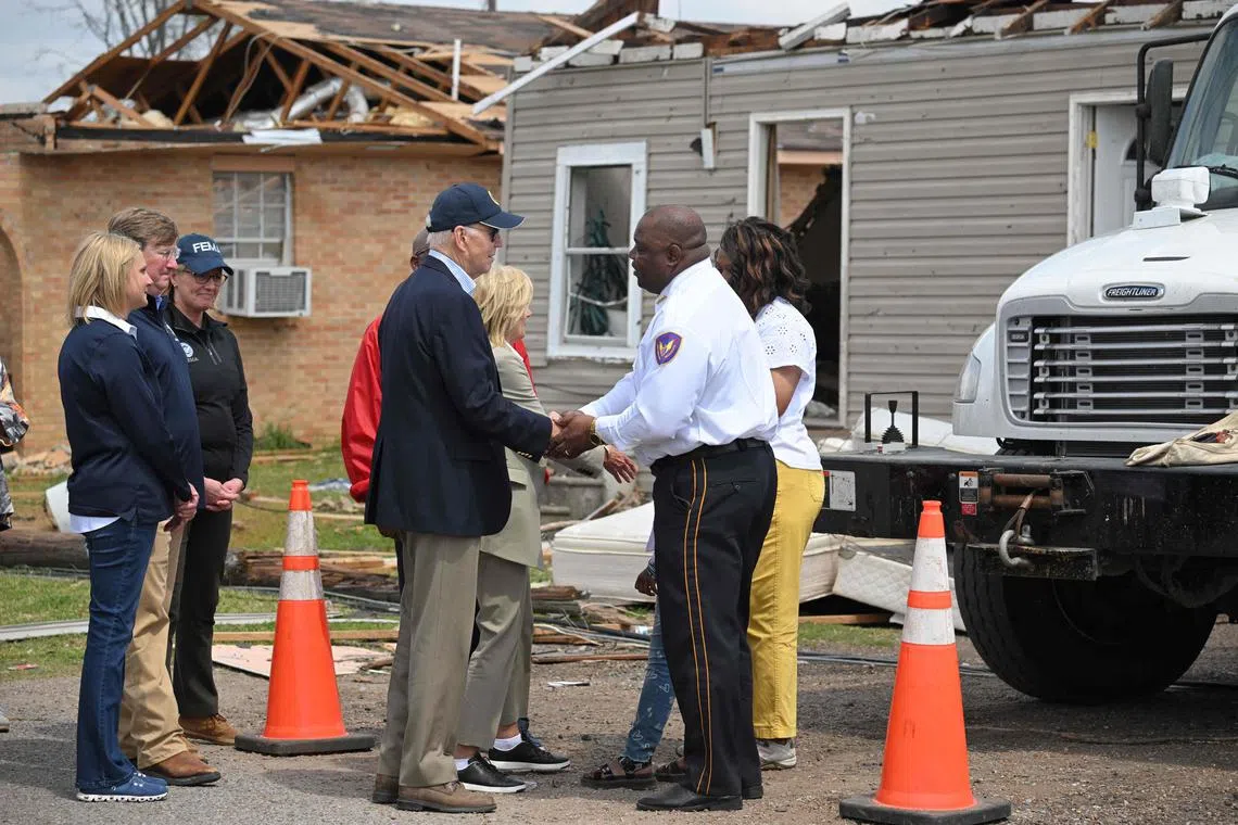 US President Joe Biden and First Lady Jill Biden tour a storm-stricken area in Rolling Fork, Mississippi.