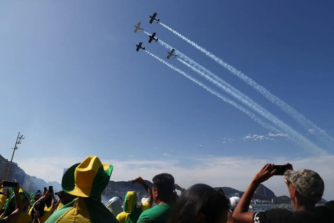 Aircrafts fly over Copacabana beach as people take part in the Independence Day celebrations, in Rio de Janeiro, Brazil September 7, 2022. REUTERS/Pilar Olivares/File Photo