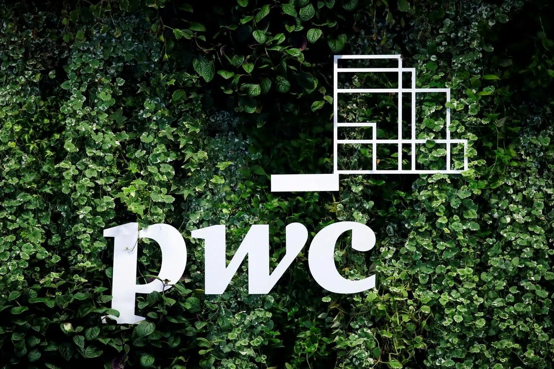 The logo of accounting firm PricewaterhouseCoopers (PwC) is seen on a board at the St Petersburg International Economic Forum in Russia on June 6, 2019.