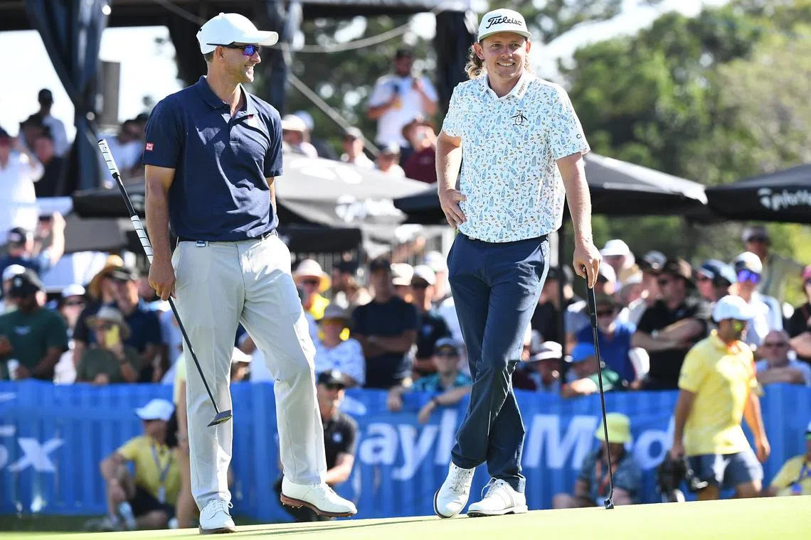 Adam Scott (left) and Cameron Smith look on during Day 2 of the Australian PGA Championship at the Royal Queensland Golf Club in Brisbane on Friday. 