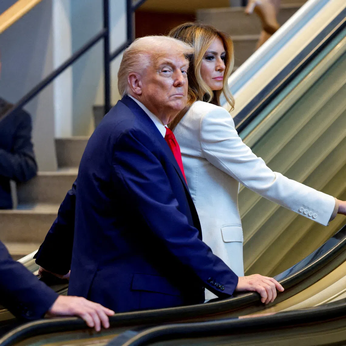 U.S. President Donald Trump and first lady Melania Trump ride an escalator as they arrive to attend the 80th United Nations General Assembly, in New York City, New York, U.S., September 23, 2025. REUTERS/Kylie Cooper