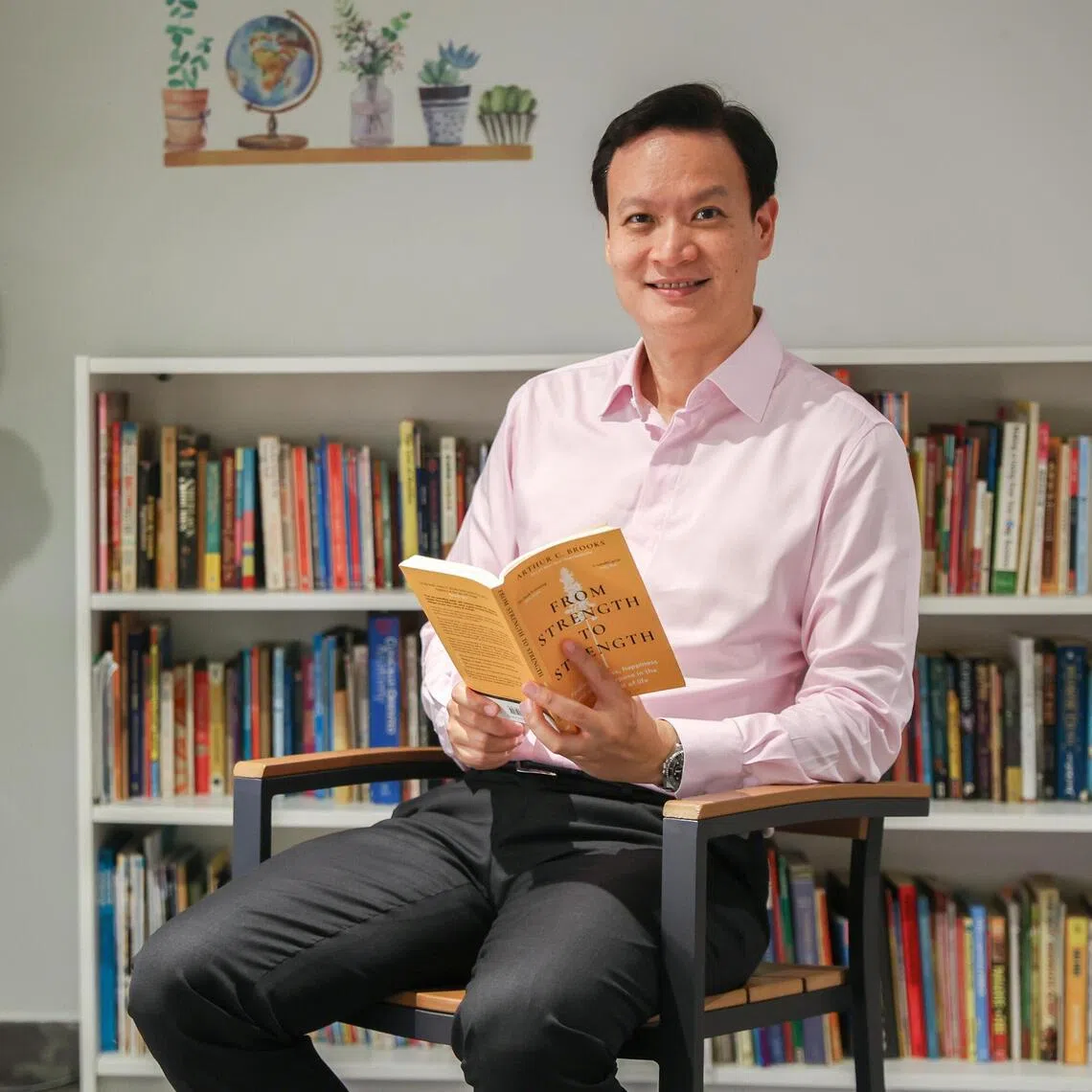 Joe Hau, chief executive officer of Woodlands Hospital, in Woodlands Hospital on July 8. He is currently reading From Strength To Strength by Arthur C. Brooks.