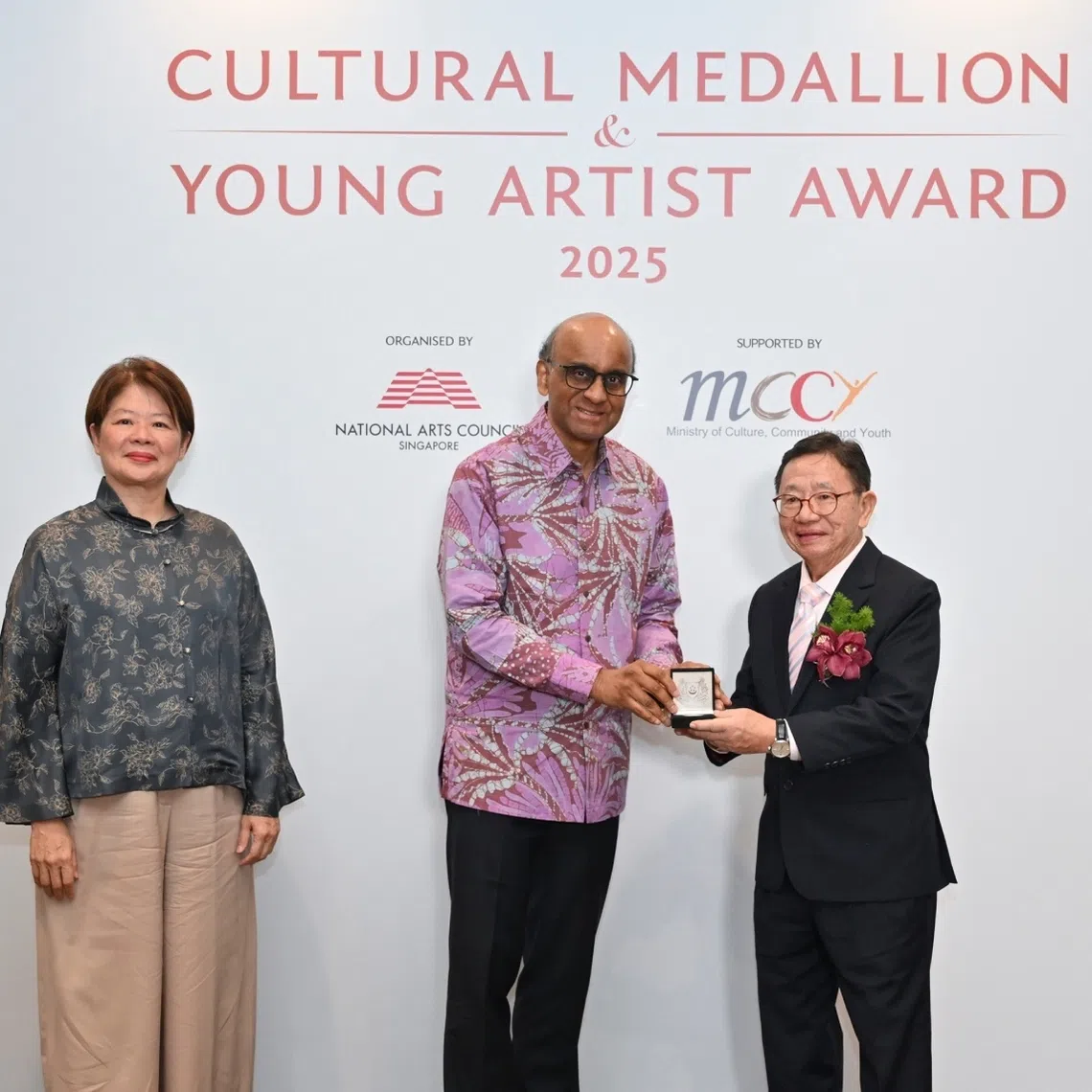 (From left) Chairman of the National Arts Council Ms Goh Swee Chen, President Tharman Shanmugaratnam conferring the Cultural Medallion to 2025 recipient Mr Nai Swee Leng.