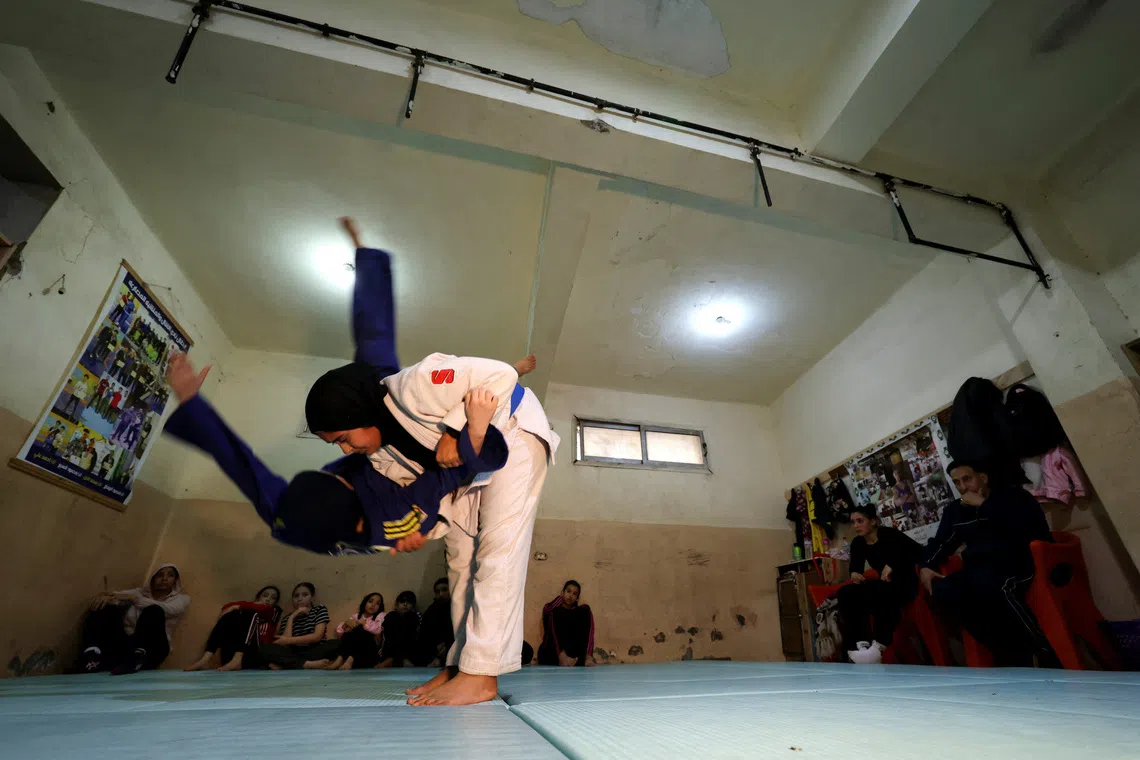 Young girls in action during a Judo training session at the one-room Manshiya club in El Mansoura, Egypt, December 15, 2025. REUTERS/Mohamed Abd El Ghany