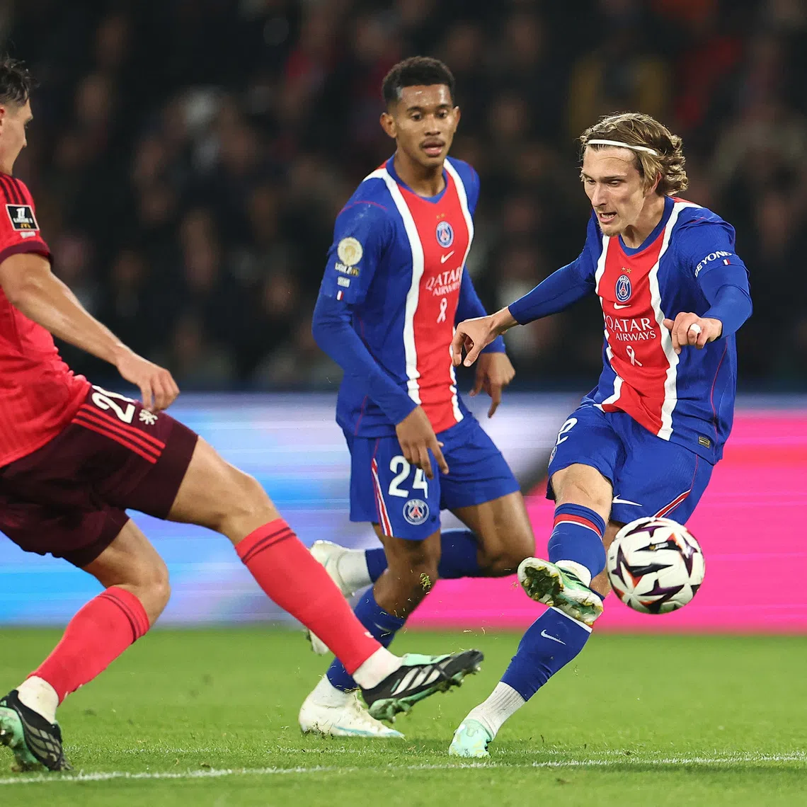 Mika Godts scores PSG’s second goal against Lyon.