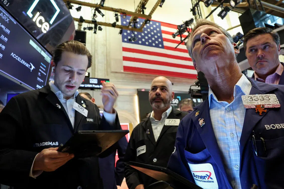 Traders working on the floor of the New York Stock Exchange on July 24, in New York City.     