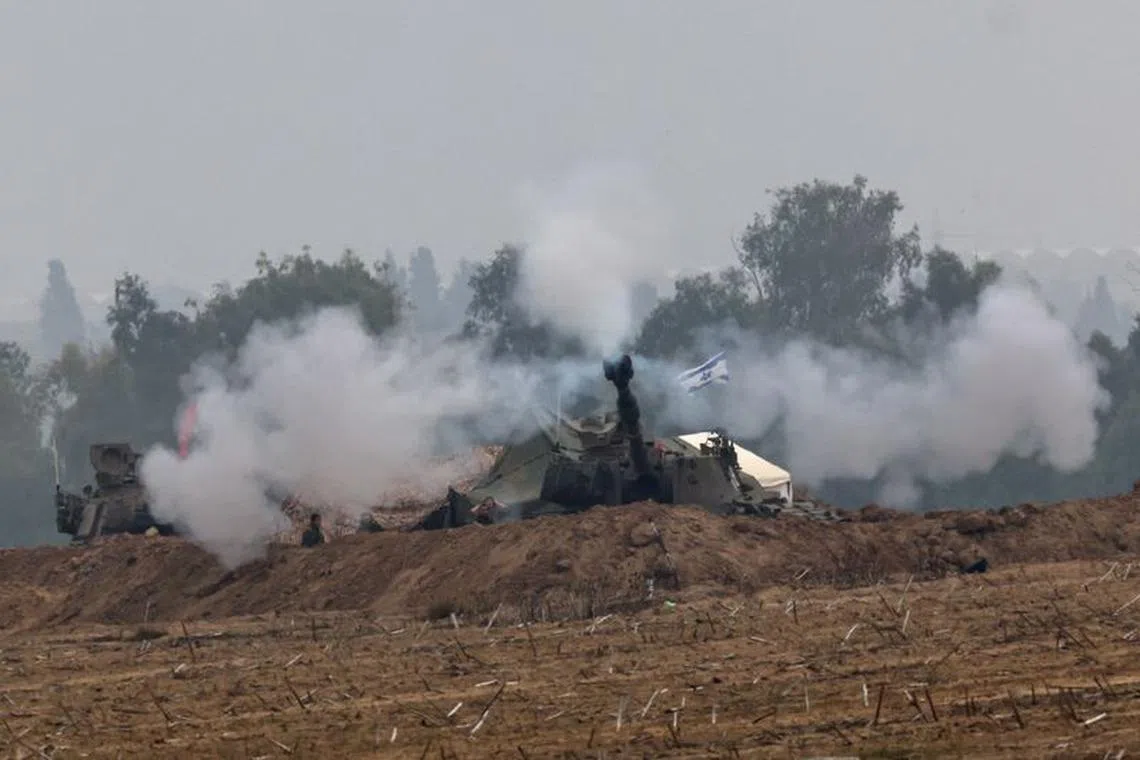 An Israeli artillery unit operates at the border with Gaza, amid the ongoing conflict between Israel and the Palestinian Islamist group Hamas, as seen from southern Israel, December 5, 2023. REUTERS/Athit Perawongmetha