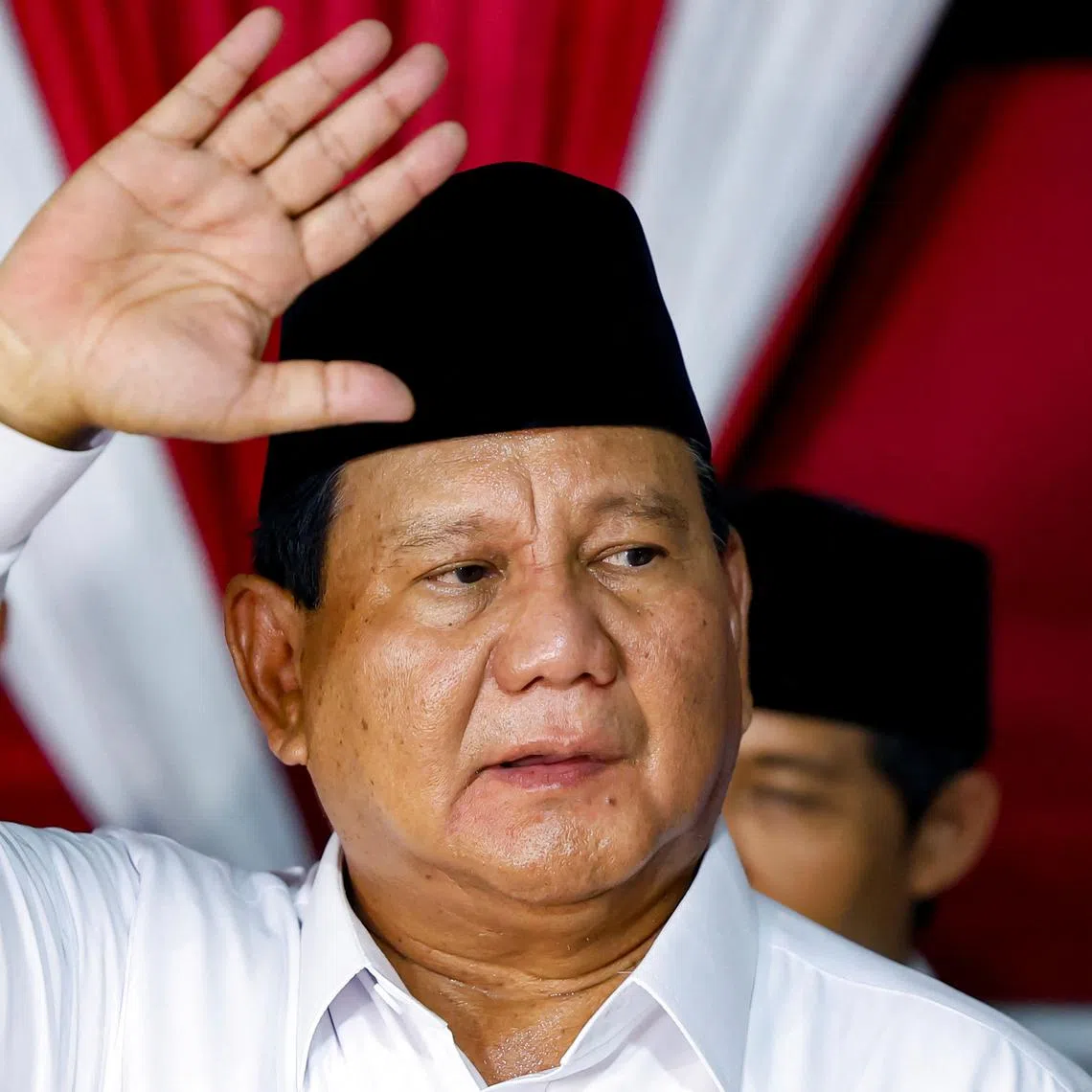 Indonesia's front-runner presidential candidate and Defence Minister Prabowo Subianto waves as he delivers his speech after the country's election commission announced last month's presidential election result, in Jakarta, Indonesia, March 20, 2024. REUTERS/Willy Kurniawan
