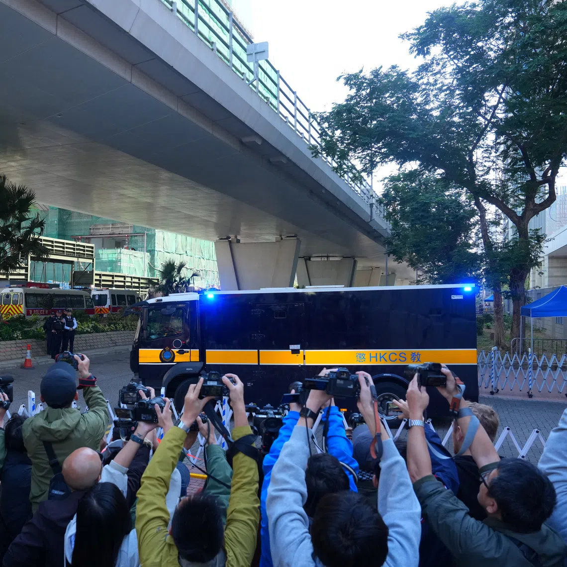 A prison van believed to be carrying Jimmy Lai leaving the West Kowloon Magistrates' Courts building in Hong Kong on Dec 15.
