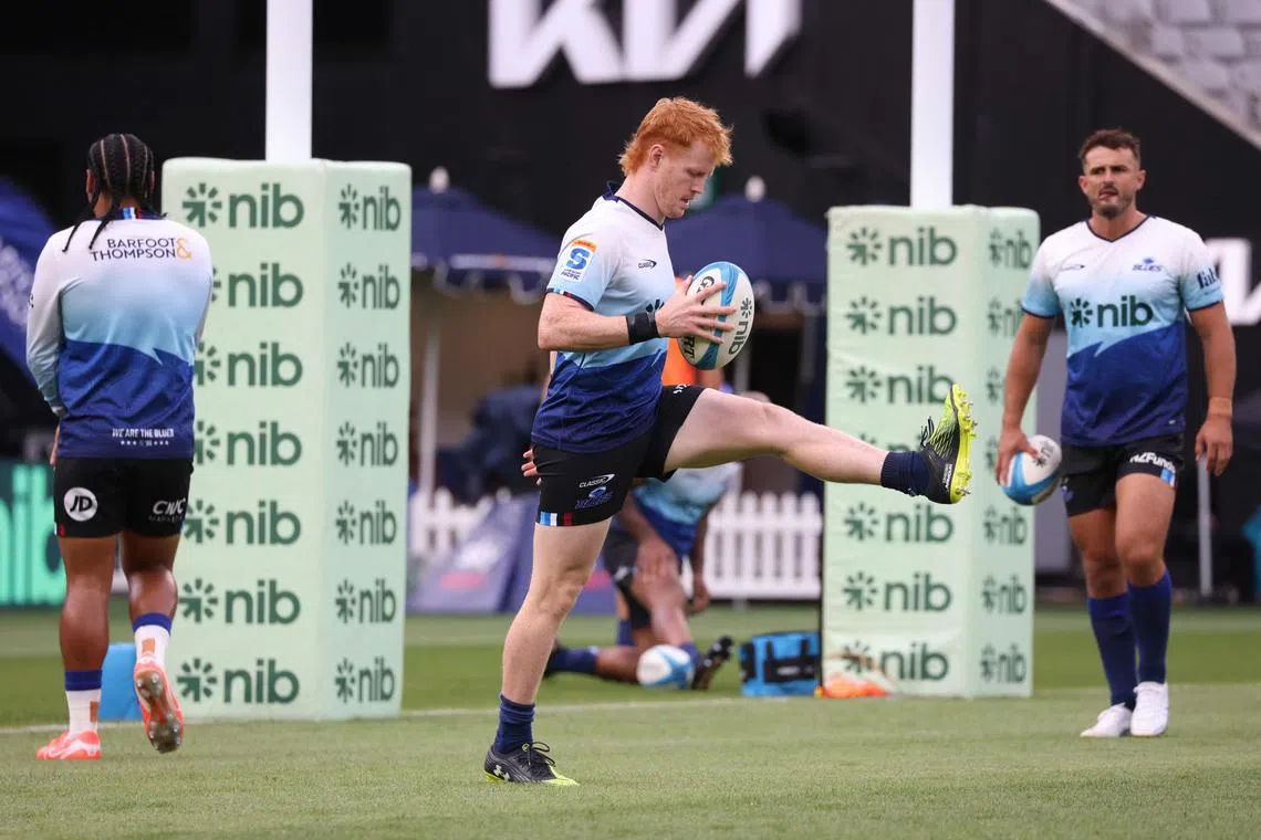 Blues Finlay Christie warms up prior to round one of the Super Rugby Pacific match between the Blues and Chiefs at Eden Park in Auckland on February 15, 2025. (Photo by Michael Bradley / AFP)