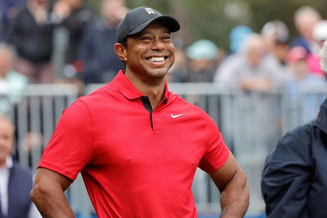 FILE PHOTO: Dec 17, 2023; Orlando, Florida, USA;  Tiger Woods smiles before he plays his shot from the first tee during the PNC Championship at The Ritz-Carlton Golf Club. Mandatory Credit: Reinhold Matay-USA TODAY Sports/File Photo