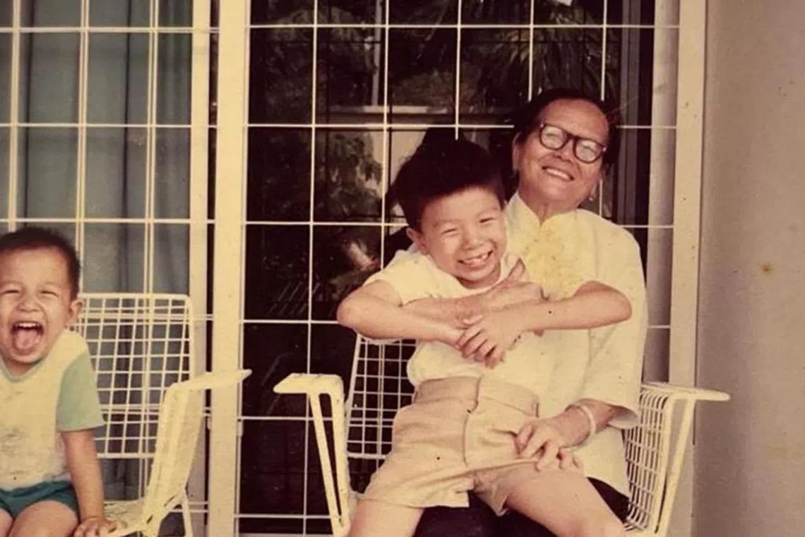 Miss Loi Ooi Toh left Mr Lim (right) her life savings of close to $100,000 when she died. Next to them is Mr Lim's younger brother.