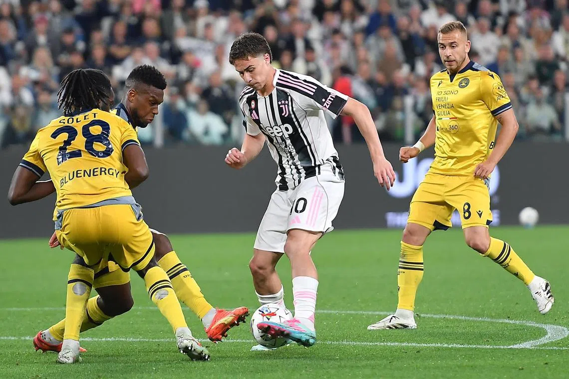 Juventus'  Kena Yldiz is challenged by Udinese' Oumar Solet Bomawoko in their Italian Serie A soccer match in Turin, Italy on  May 18, 2025.
